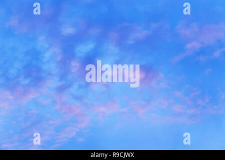 43,441.03660 Deep blue and pink sunset sky with mottled irregular almost cotton-ball like clouds Stock Photo