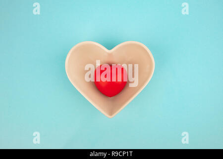 Heart Bowl isolated on light blue background Stock Photo