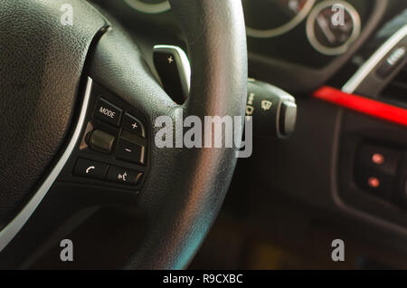 Close up of volume control switch volume keys on the steering wheel Stock Photo