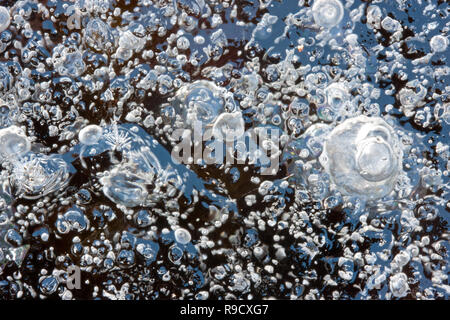 Gas bubbles captured in ice Stock Photo