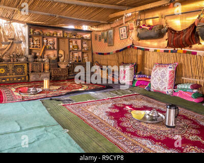 Bedouin tent interior in Oman desert village, Wahiba Sands Stock Photo