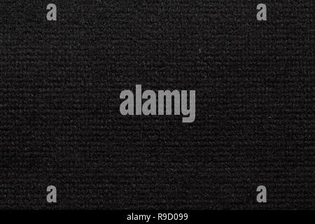 Classic textile background in dark colour on macro. Stock Photo