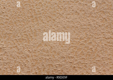 Simple textile background in gentle beige tone. Stock Photo