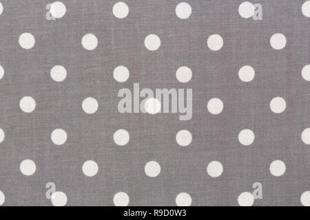 Grey polka dot fabric texture on macro, background. Stock Photo