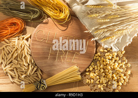 Gluten free food. Various pasta on wooden background from top view. Healthy and diet concept. Stock Photo