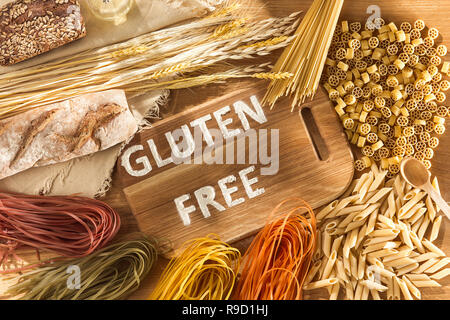 Gluten free food. Various pasta on wooden background from top view. Healthy and diet concept. Stock Photo