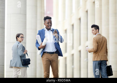 Cheerful engineer talking via video link Stock Photo