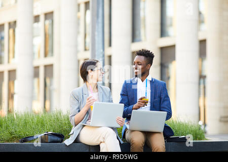 Optimistic colleagues enjoying work Stock Photo