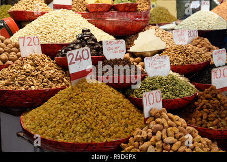 Spice market assorted fresh dried fruits, nuts, seeds and spices in the in Old Delhi, India. Stock Photo