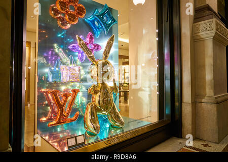 MILAN, ITALY - CIRCA NOVEMBER, 2017: a window display at Louis Vuitton store in Galleria Vittorio Emanuele II. Stock Photo