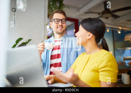 Colleagues talking in cafe Stock Photo