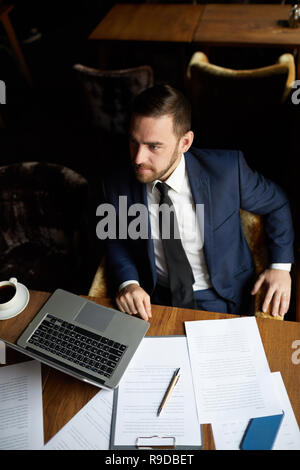 Content businessman making order in restaurant Stock Photo