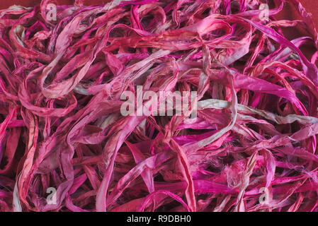 Pink silk ribbons background. Texture. Close-up shot, macro photography. Stock Photo