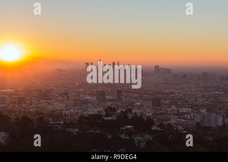 Los Angeles, California, USA - December 16, 2018:  Orange sunrise cityscape view of Hollywood and downtown LA. Stock Photo