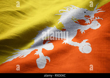 Closeup of Ruffled Bhutan Flag, Bhutan Flag Blowing in Wind Stock Photo