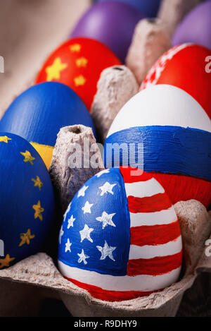 Easter eggs painted in the colors of flags of different states, close-up Stock Photo