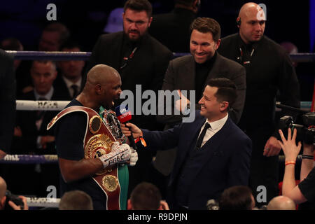 London, UK. 22nd Dec, 2018. WBC Silver and WOB International Heavyweight Championship Boxing, Dillian Whyte versus Dereck Chisora; Dillian Whyte celebrates his KO win during an interview with SkySport and promoter Eddie Hearn Credit: Action Plus Sports Images/Alamy Live News Stock Photo