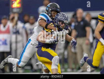 Arlington, Texas, USA. 12th Dec, 2018. Highland Park's Benner Page #22 is tackled by a Shadow Creek defender during the UIL Texas state championships football game between the Highland Park Scots and the Shadow Creek Sharks at AT&T Stadium in Arlington, Texas. Kyle Okita/CSM/Alamy Live News Stock Photo