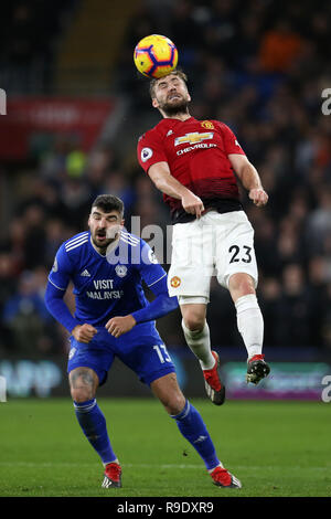 Cardiff, UK. 22nd Dec, 2018. Luke Shaw of Manchester United (23) heads the ball . Premier League match, Cardiff City v Manchester Utd at the Cardiff City Stadium on Saturday 22nd December 2018. this image may only be used for Editorial purposes. Editorial use only, license required for commercial use. No use in betting, games or a single club/league/player publications. pic by Andrew Orchard/Andrew Orchard sports photography/Alamy Live news Credit: Andrew Orchard sports photography/Alamy Live News Stock Photo