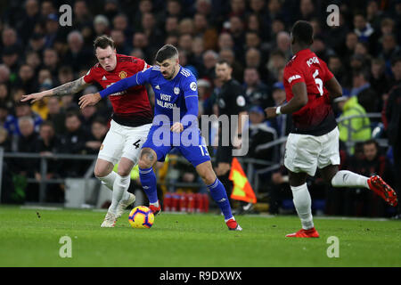 Cardiff, UK. 22nd Dec, 2018. Callum Paterson of Cardiff city Credit: is challenged by Phil Jones of Manchester United (l). Premier League match, Cardiff City v Manchester Utd at the Cardiff City Stadium on Saturday 22nd December 2018. this image may only be used for Editorial purposes. Editorial use only, license required for commercial use. No use in betting, games or a single club/league/player publications. pic by Andrew Orchard/Andrew Orchard sports photography/Alamy Live News Stock Photo