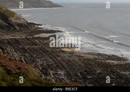 The coastline geology from Pwlldu Bay to Caswell bay is revealed at Low tide. Gower Peninsula coast in south Wales Stock Photo