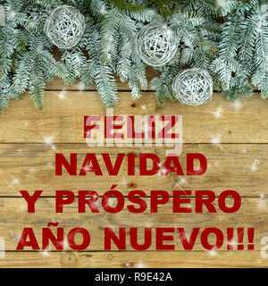 Fir tree with silver glitter balls on wooden natural and rough background. Christmas postcard. "Feliz NAvidad " Stock Photo