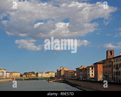 blue sky & fluffy clouds over the view downriver from Ponte di Mezzo to Ponte della Fortezza, both reconstructed bridges on The Arno in Pisa, Italy Stock Photo