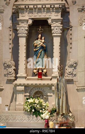 One of the beautiful side altars of the church of Santa Luzia in Viana do Castelo, north of Portugal, with images of Our Lady Stock Photo