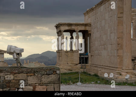 This view of the illuminated sky over the city of modern Athens seen through the columns of old Temple of Athena Nike was impossible to put into words Stock Photo