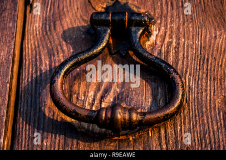 Door handle on an old wood door Stock Photo