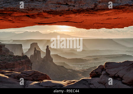 sunrise behind Mesa Arch in Canyonlands National Park, Island in the Sky, Moab, Utah, USA, North America