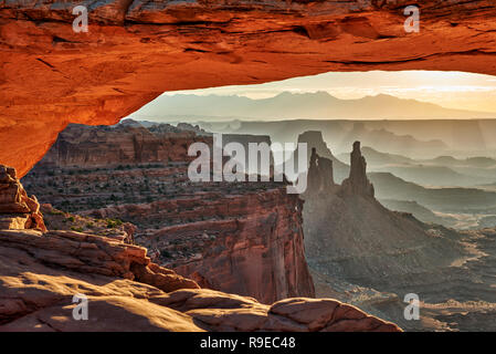 sunrise behind Mesa Arch in Canyonlands National Park, Island in the Sky, Moab, Utah, USA, North America Stock Photo