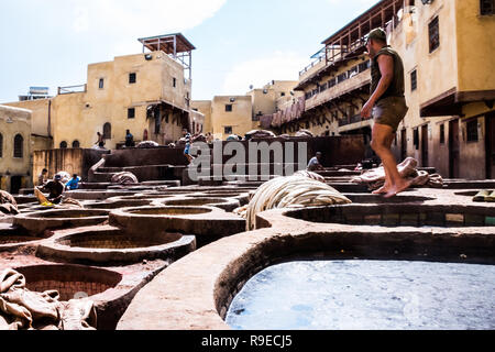 Fez - Morocco - September 29, 2018: Men working in the leather tanneries in Fez, Morocco Stock Photo