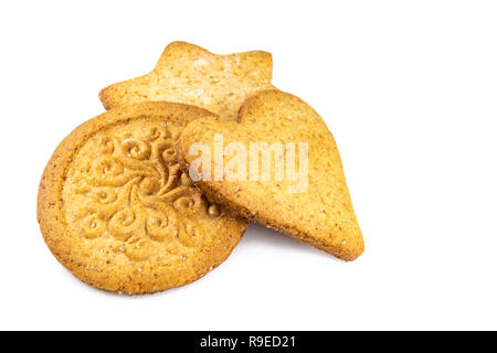 Three pieces of round, heart and star shaped gingerbread with patterns isolated on white Stock Photo