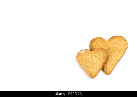 Two pieces of different size heart shaped gingerbread with copy space isolated on white, top view Stock Photo
