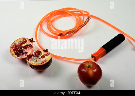 jumping rope and fruit isolated on white background. Stock Photo