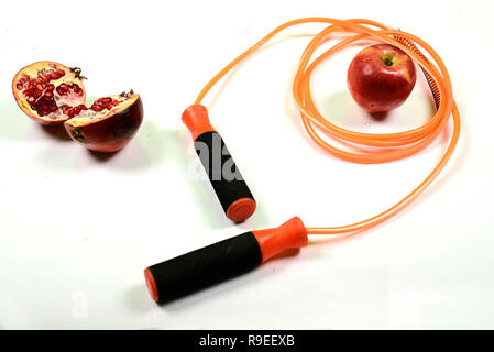 jumping rope and fruit isolated on white background. Stock Photo