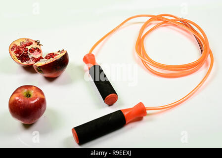 jumping rope and fruit isolated on white background. Stock Photo