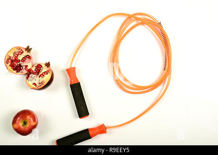 jumping rope and fruit isolated on white background. Stock Photo