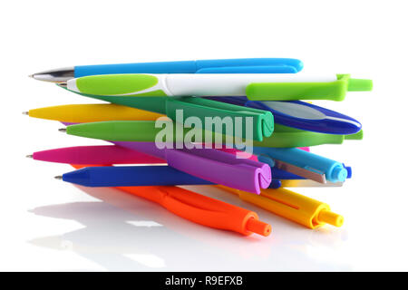 Multi colored ball pens on white background Stock Photo