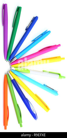 Multi colored ball pens on white background Stock Photo