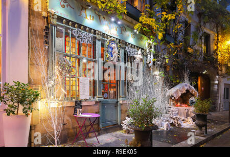 The traditional French cafe Au viex Paris d'Arcole decorated for Christmas at night ,Paris, France. Stock Photo