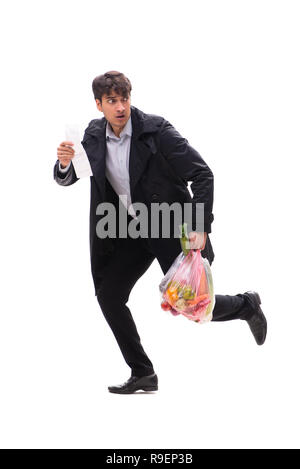 Young handsome man with vegatables in shopping concept Stock Photo