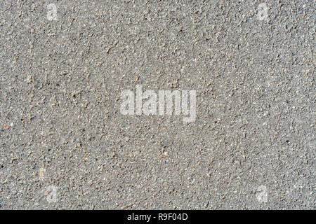 Fragment of a wall from old concrete of gray color with color splashes for use as a background. Stock Photo