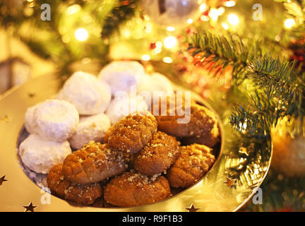 greek melomakarona and kourabies - traditional Christmas cookies with honey and nuts and sugar buns Stock Photo