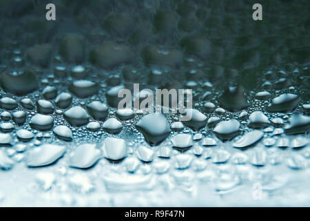 Drops of water on a window pane close-up Stock Photo
