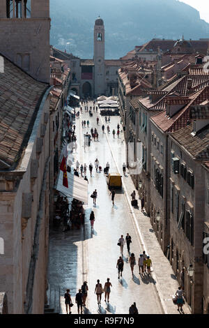 View along the main street in Dubrovnik old town, towards the bell tower and Loggia Stock Photo
