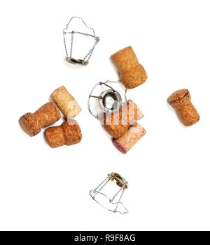 Corks from champagne wine and muselets. Isolated on white background. View from above. Stock Photo