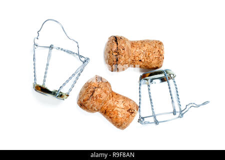 Corks from champagne wine and muselets after party. Isolated on white background. Stock Photo
