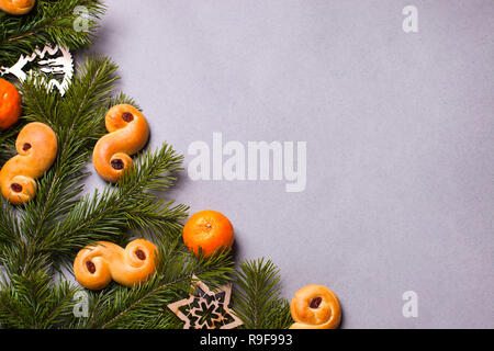 Frame with Traditional saffron buns, tradition in Sweden at Lucia and Christmas, xmas decorations, in Swedish languag called 'lussekatt' or 'lussebull Stock Photo